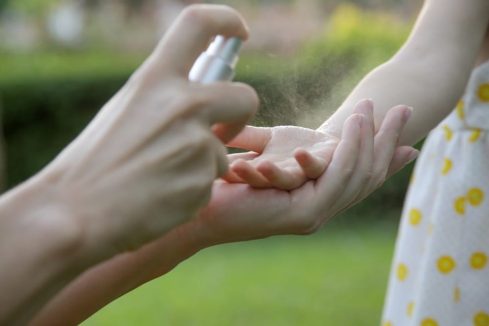Spraying a child's hand